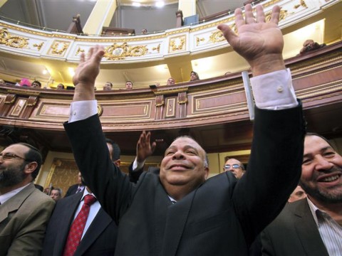 Saad Al-Katatny, a Muslim Brotherhood's senior member, waves after being nominated by the Freedom and Justice Party for the post of the Parliament Speaker